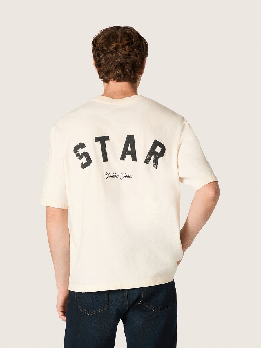 unisex katoenen t-shirt met sterrenprint in vintage wit met zwarte opdruk op de achterkant.