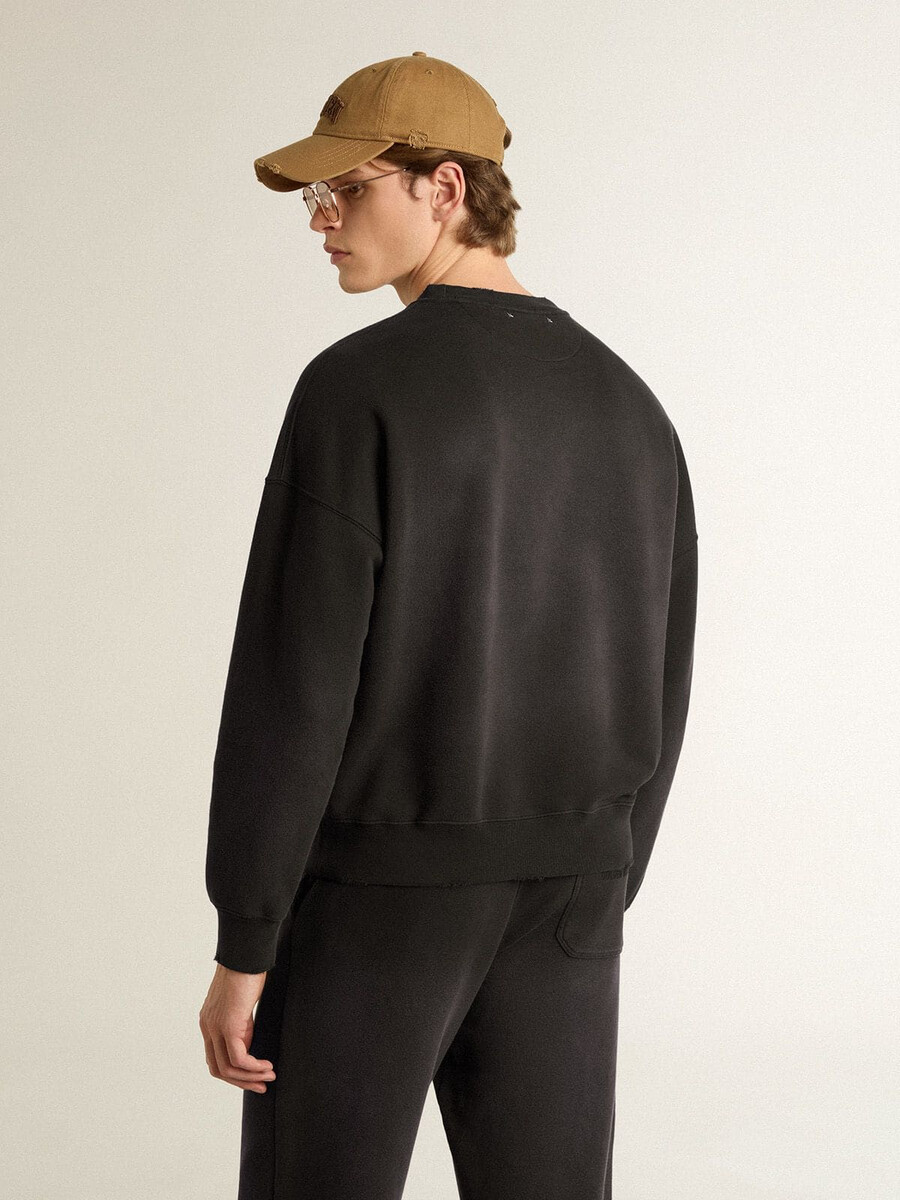 unisex sweatshirt van verwassen zwart katoen met logo-borduurwerk.