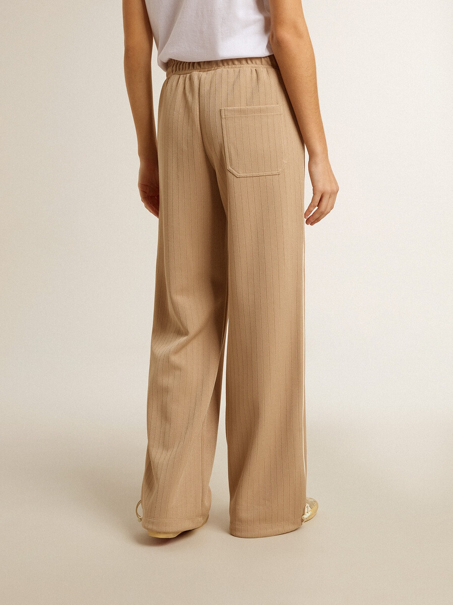 damesjoggingbroek in lichtbeige met wit logo