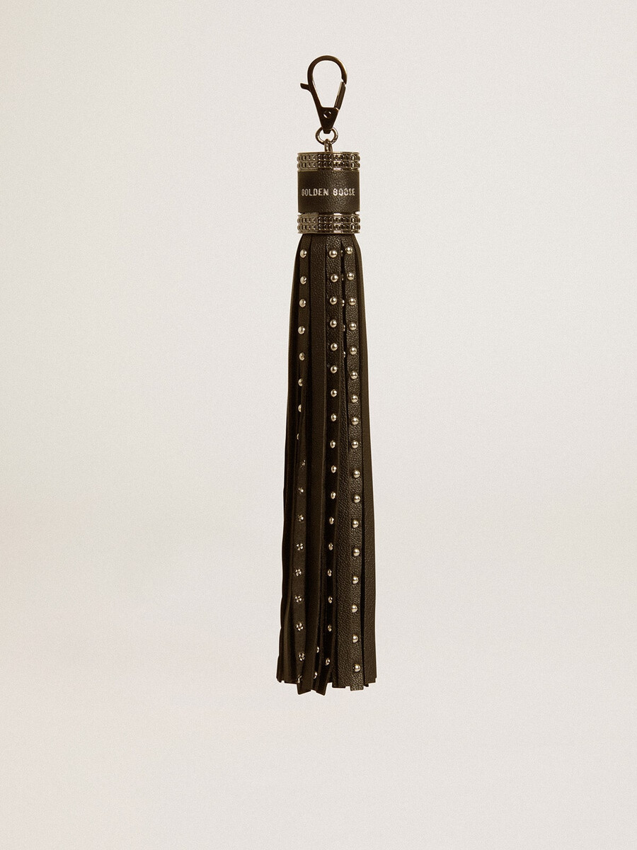 charme in zwart nappaleer met studs en metalen details.