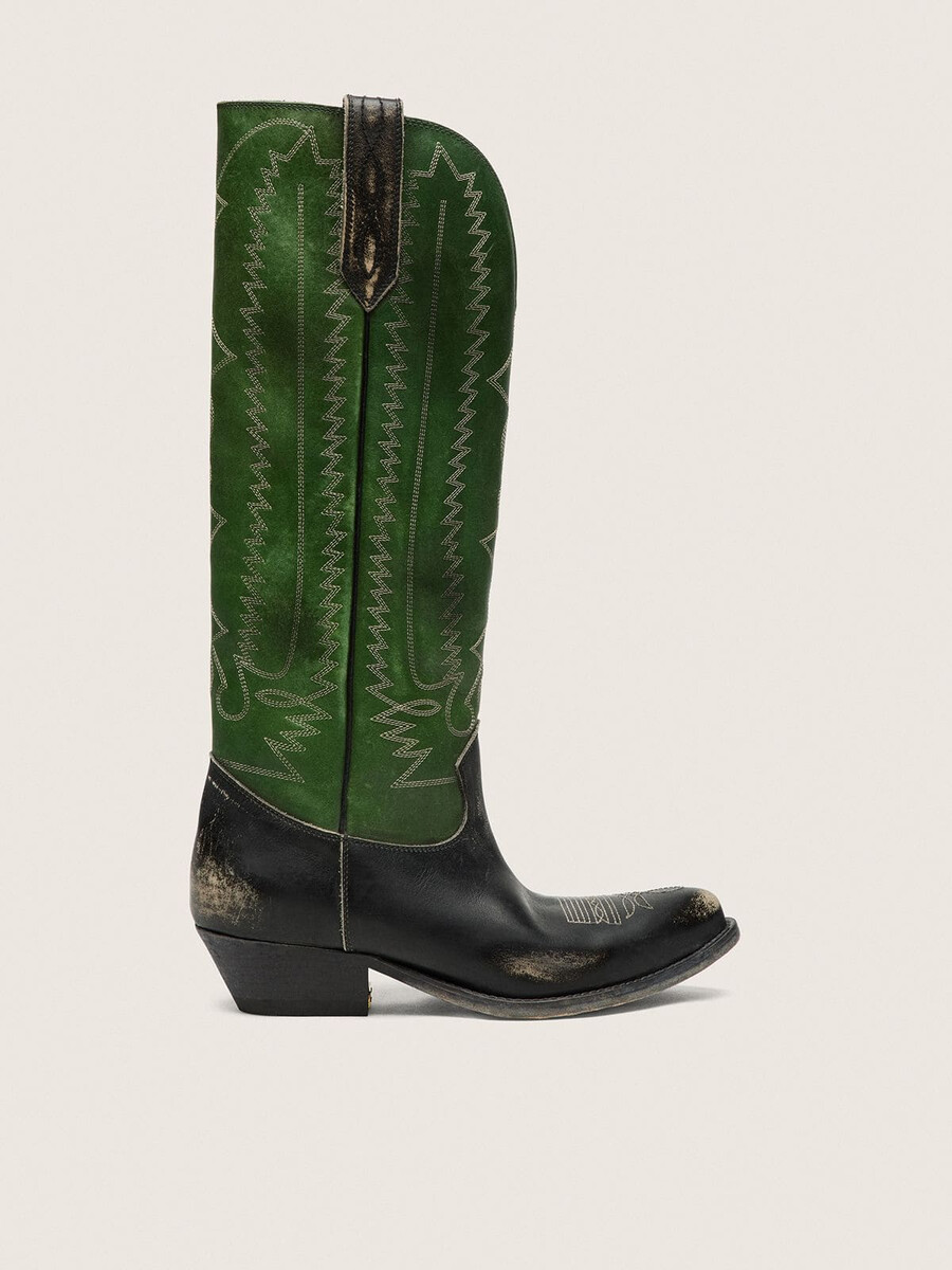 dameslaarzen met hoge wish star-print in zwart leer met een groene leren schacht en witte borduursels.