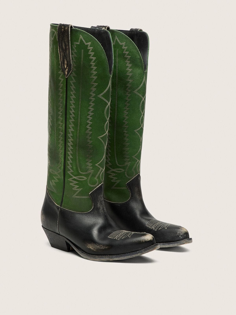 dameslaarzen met hoge wish star-print in zwart leer met een groene leren schacht en witte borduursels.