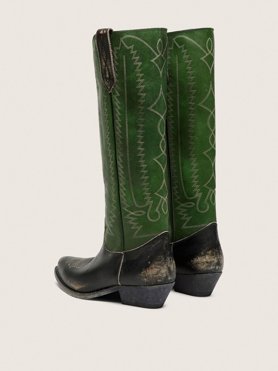 dameslaarzen met hoge wish star-print in zwart leer met een groene leren schacht en witte borduursels.