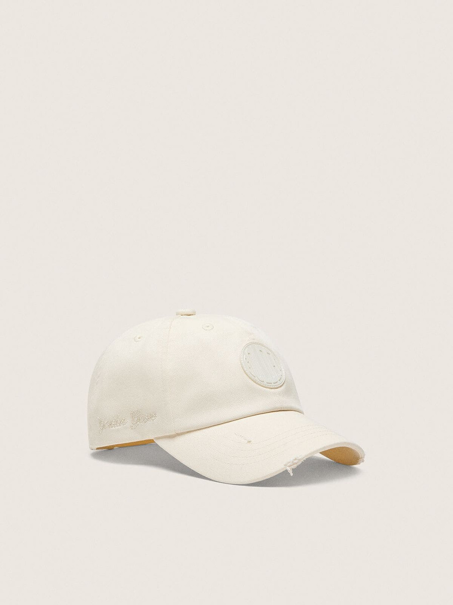 journey baseballpet van witte katoenen twill met patch en golden goose-borduurwerk.