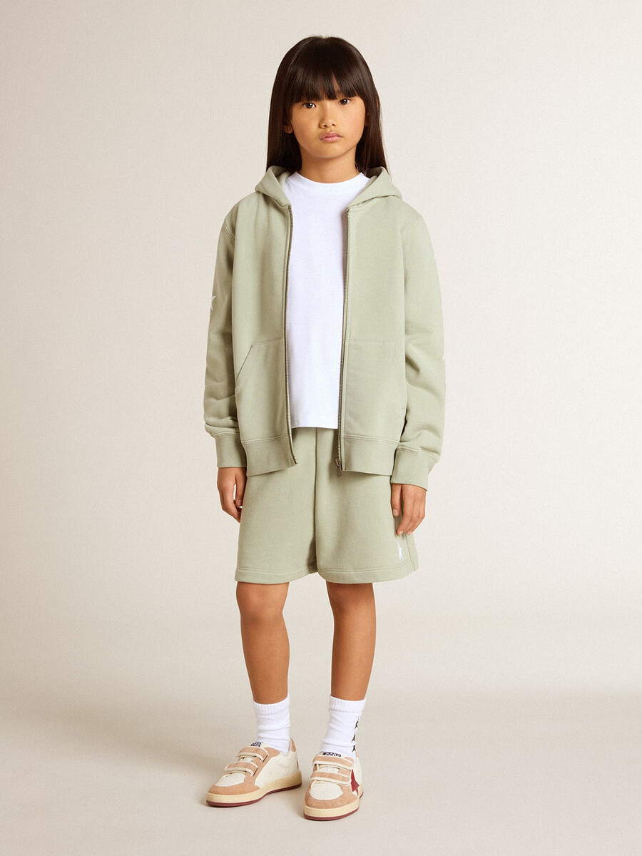 lichtgroene sweater met ritssluiting.