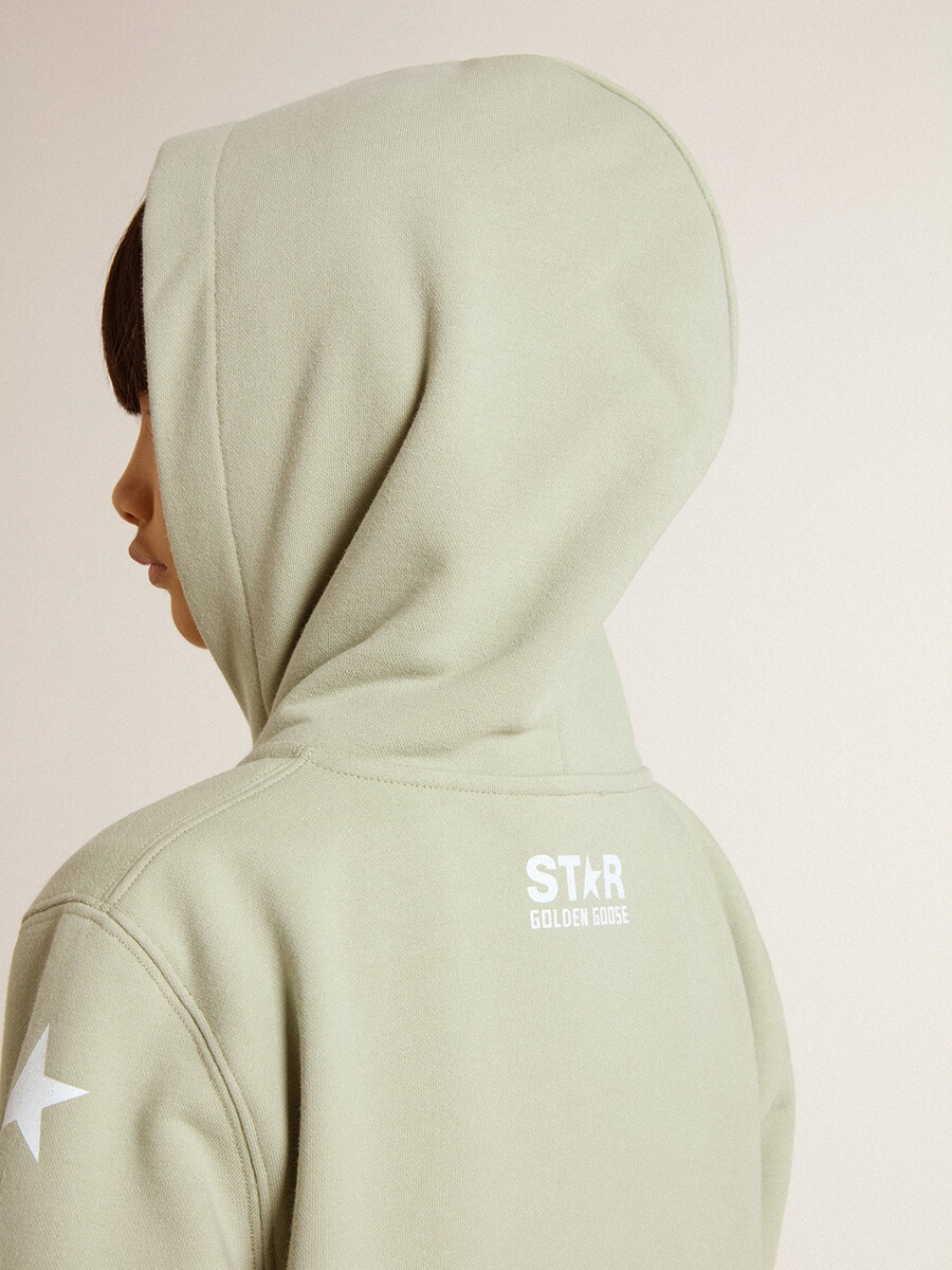 lichtgroene sweater met ritssluiting.