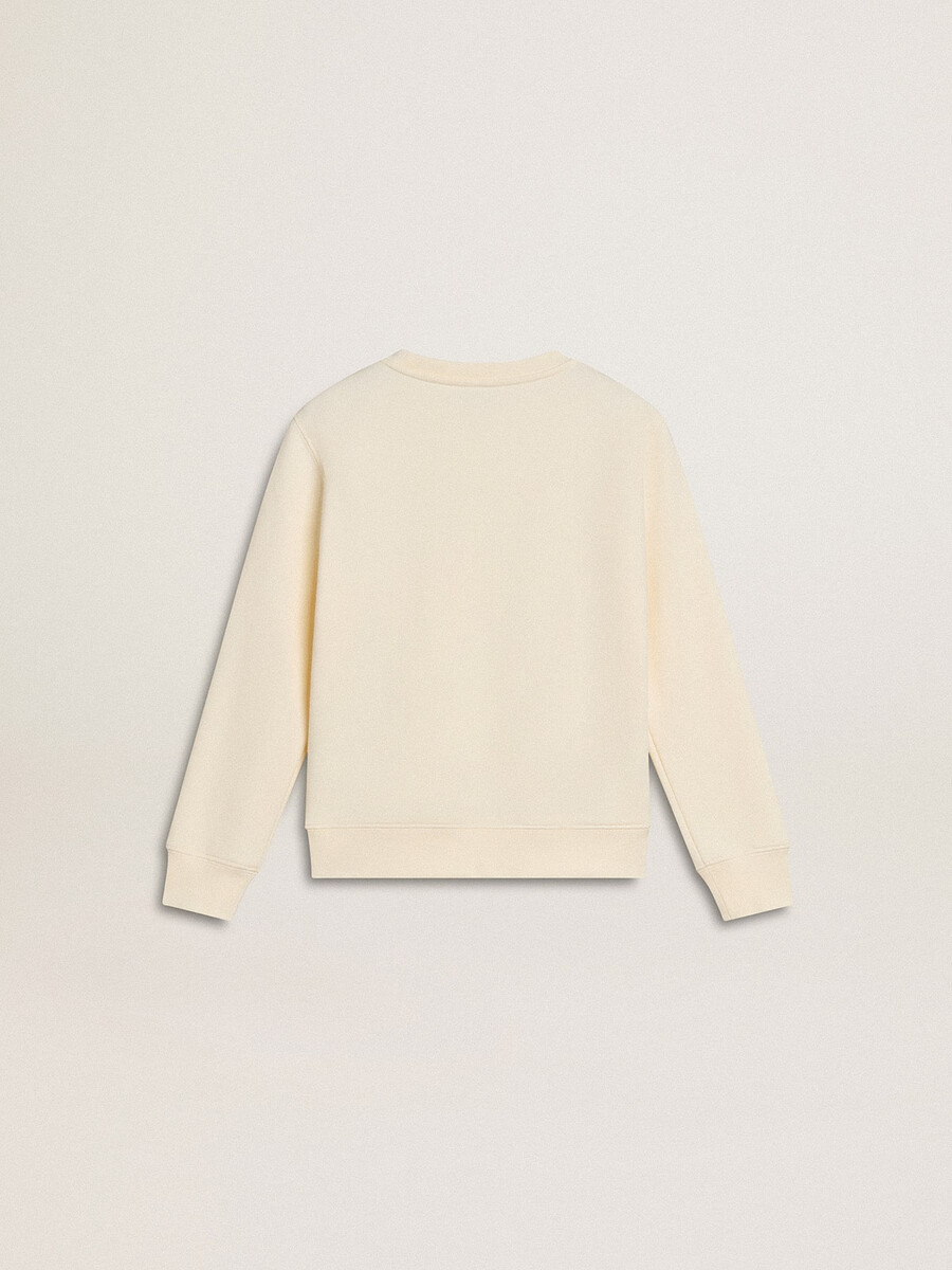 sweatshirt in verouderd wit met veelkleurige gouden letters op de voorkant.