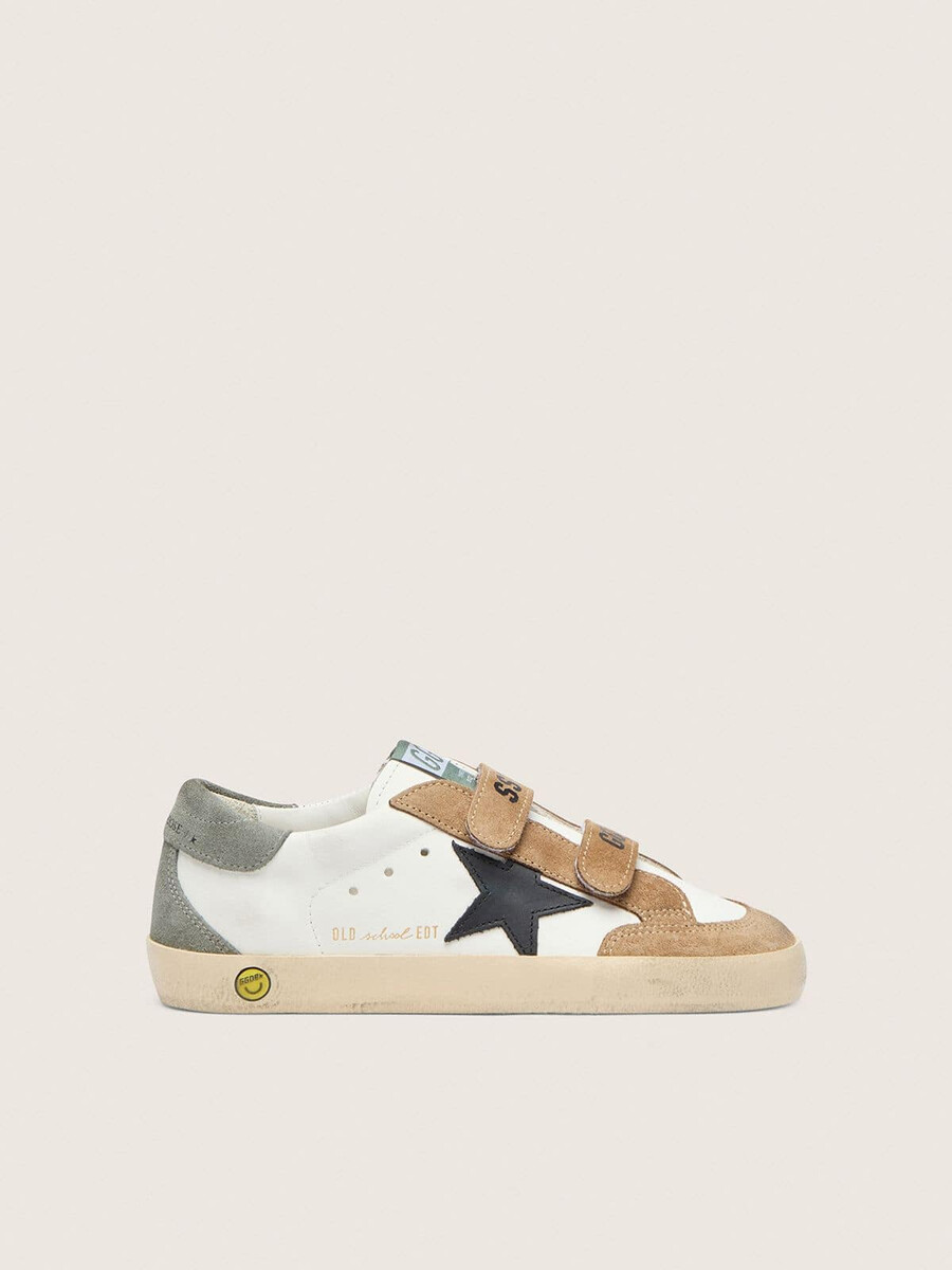 young old school met een zwarte leren ster en beige en groene suède inzetstukken.