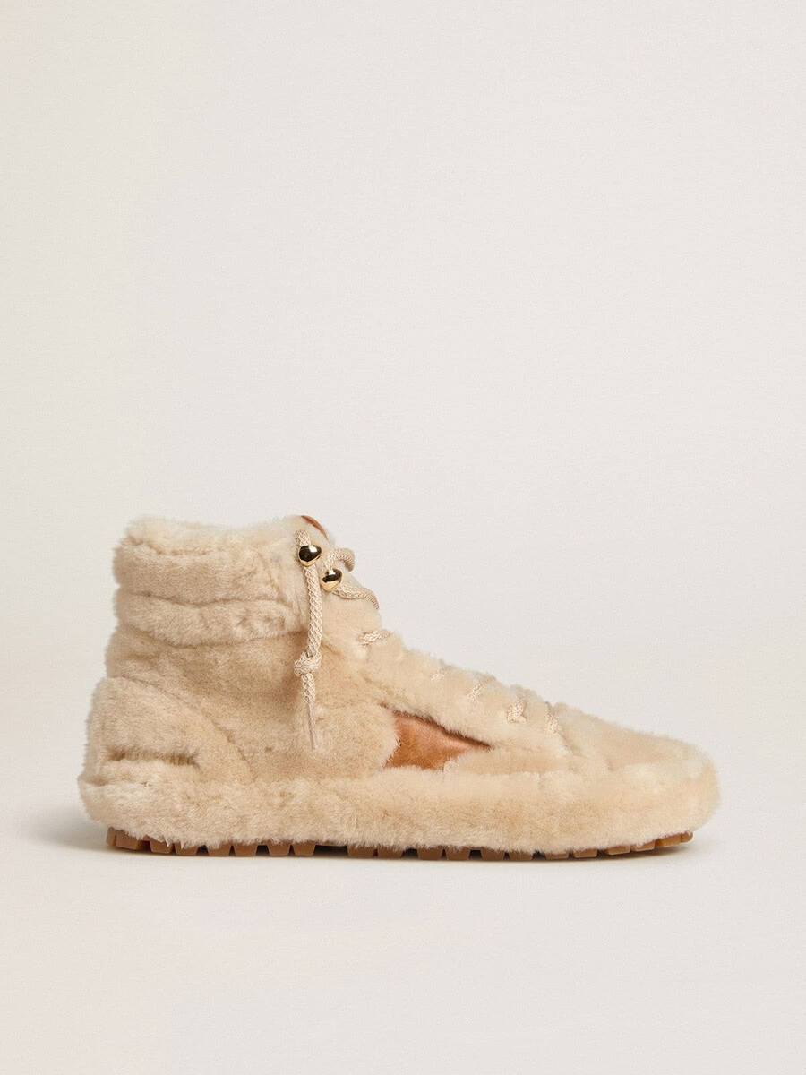 dames francy in beige schapenvacht met bruine leren ster