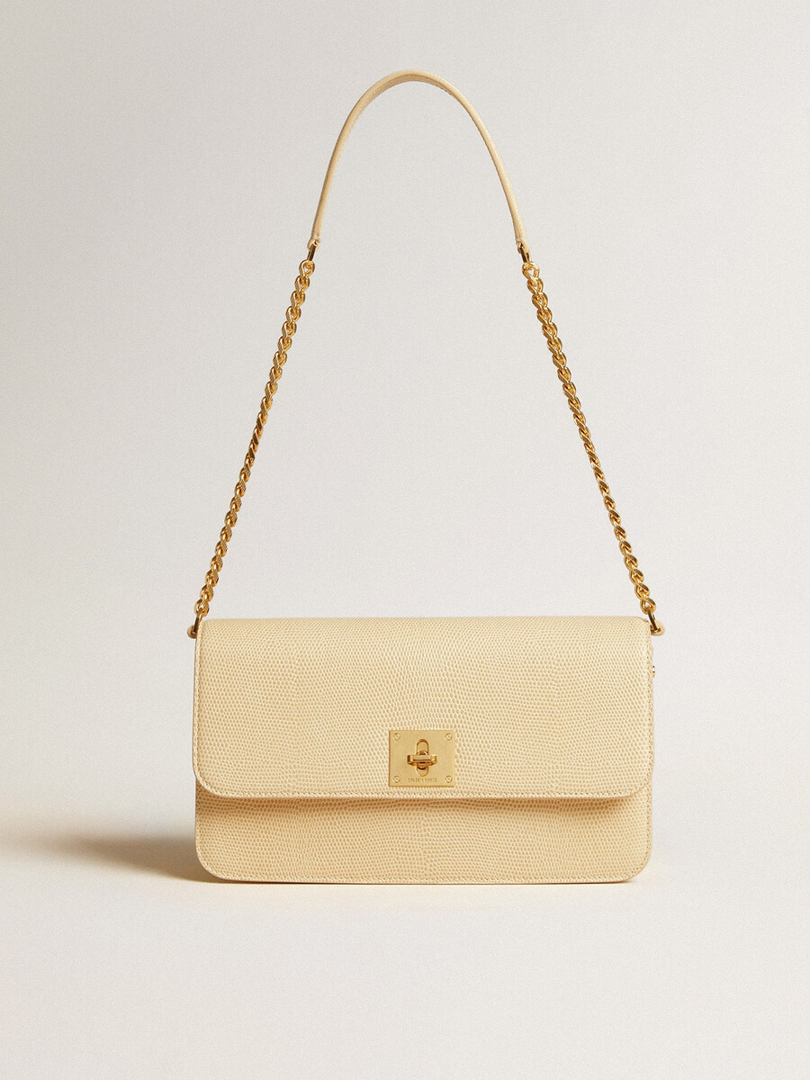 gioia-tas van vanillekleurig schapenleer met gouden details.