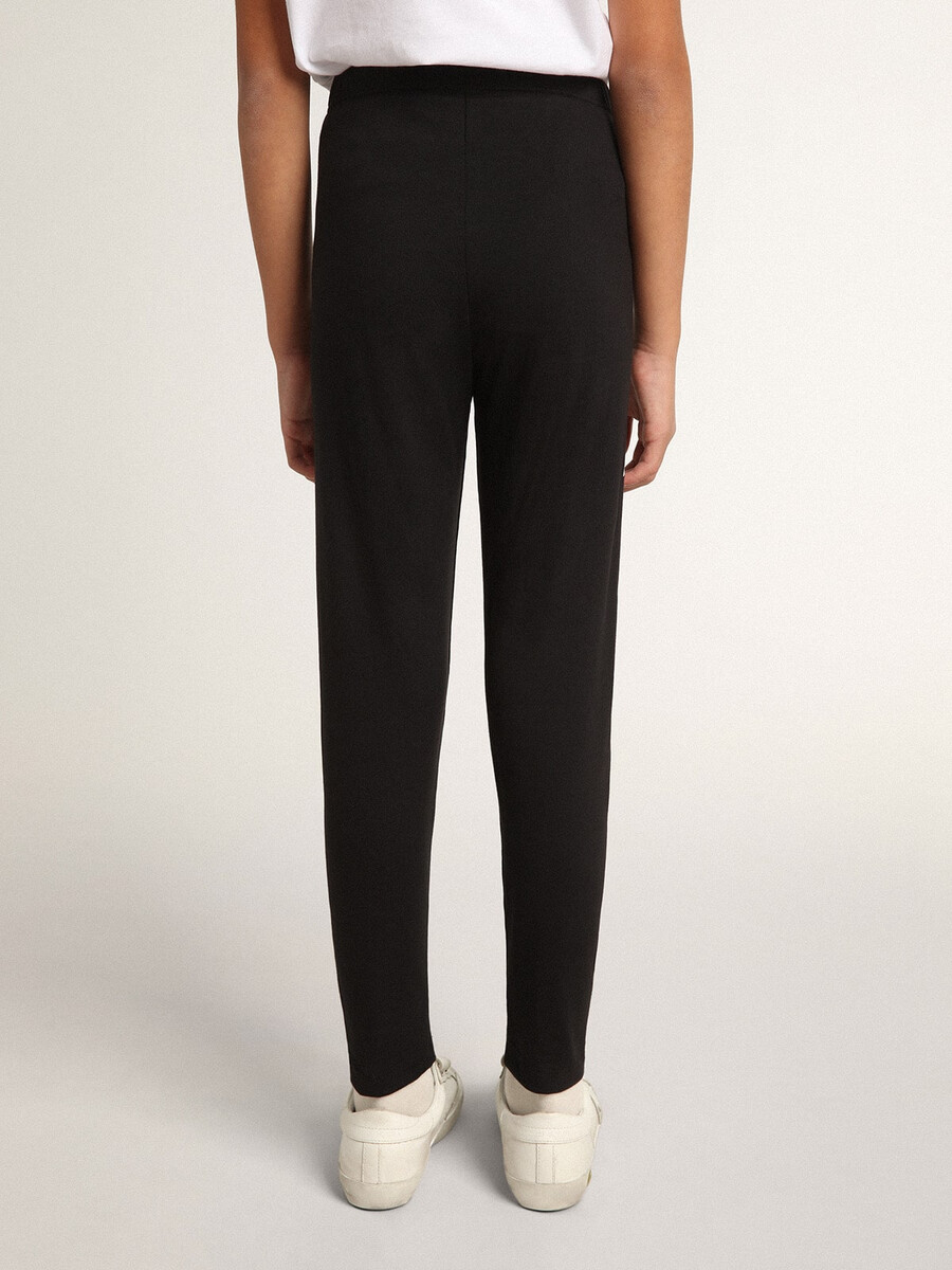 zwarte legging voor meisjes met witte sterren aan de zijkanten.