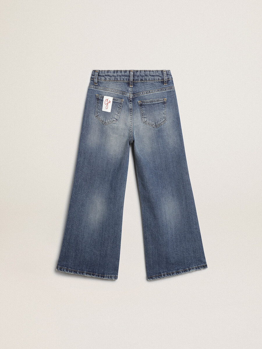 jeans met wijde pijpen in een middenblauwe denimstof.