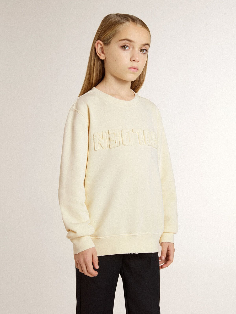 crèmekleurig sweatshirt voor meisjes met opdruk.