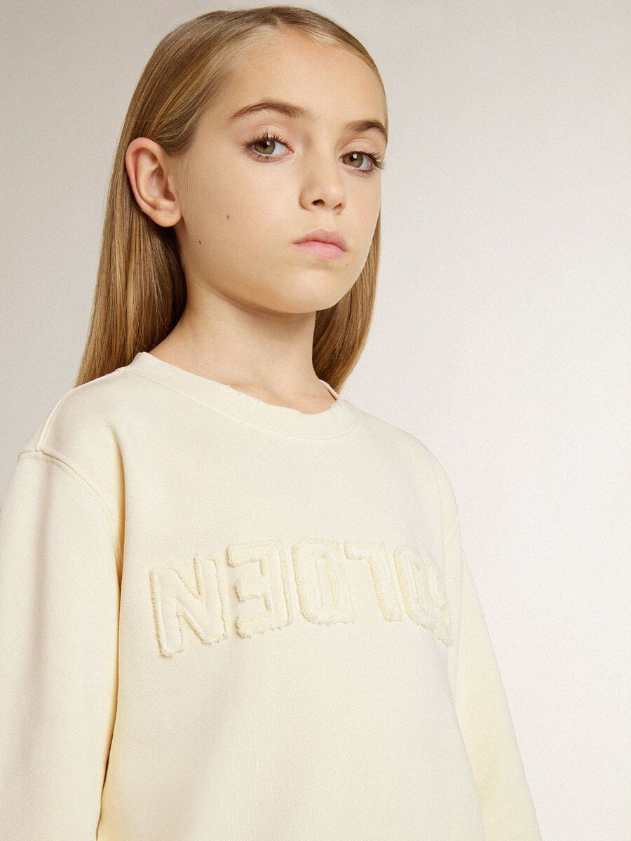 crèmekleurig sweatshirt voor meisjes met opdruk.