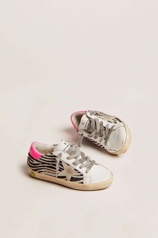 junior super-star in leer en zebraprint ponyhuid met fuchsia hielstuk
