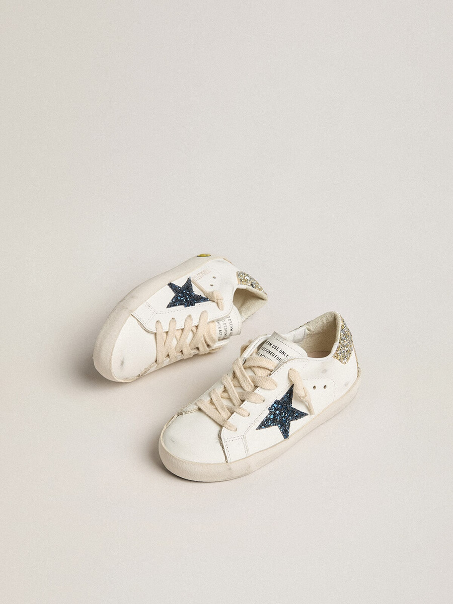 junior super-star in leer met glitterster en hielstuk.