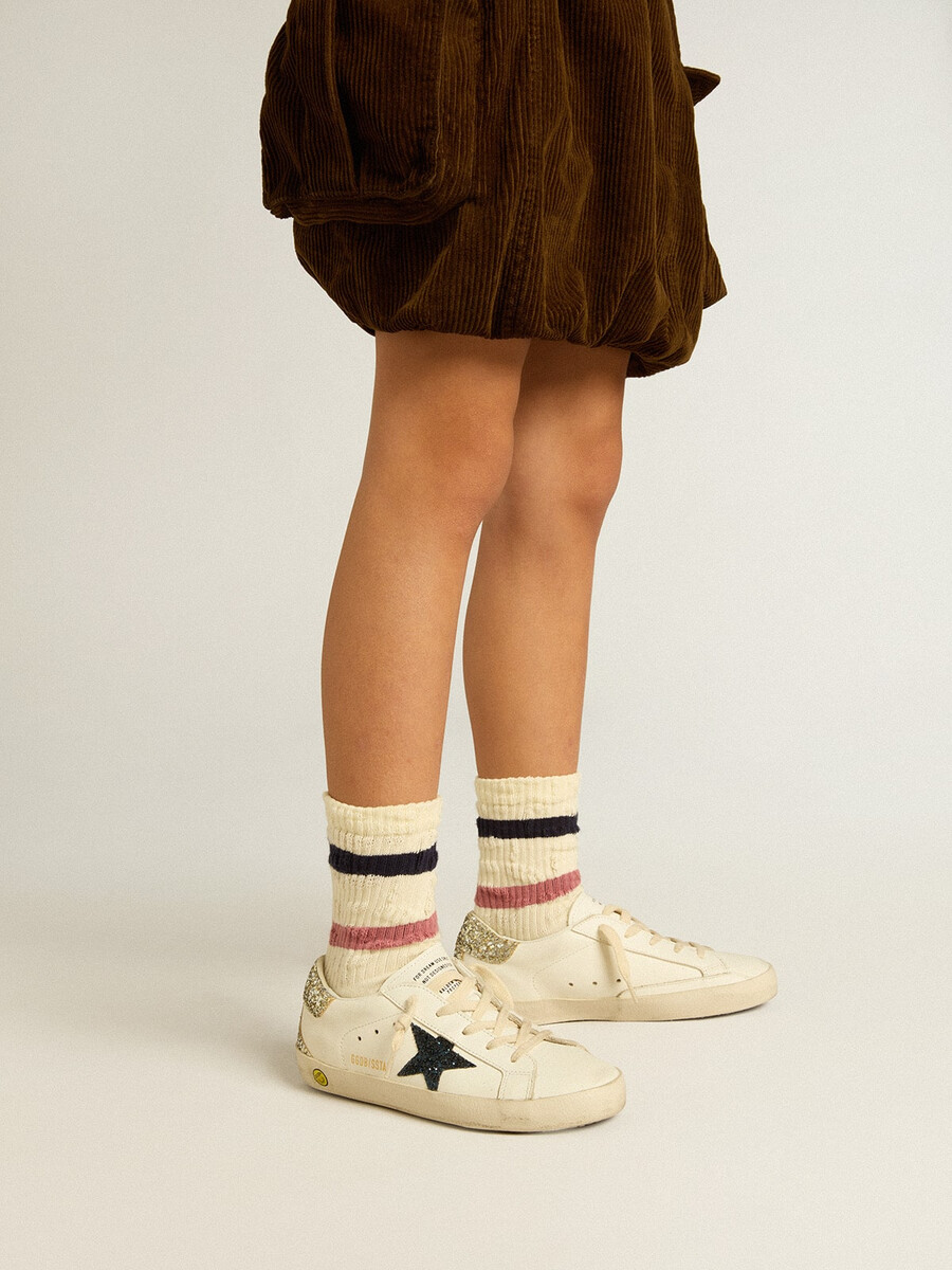 junior super-star in leer met glitterster en hielstuk.