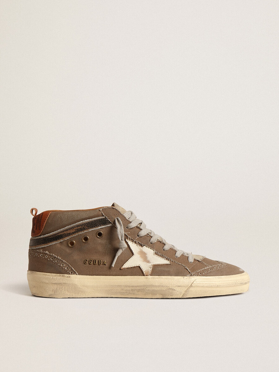 mid star in groen canvas met leren ster en zwarte flits.