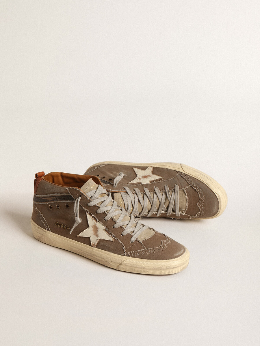 mid star in groen canvas met leren ster en zwarte flits.