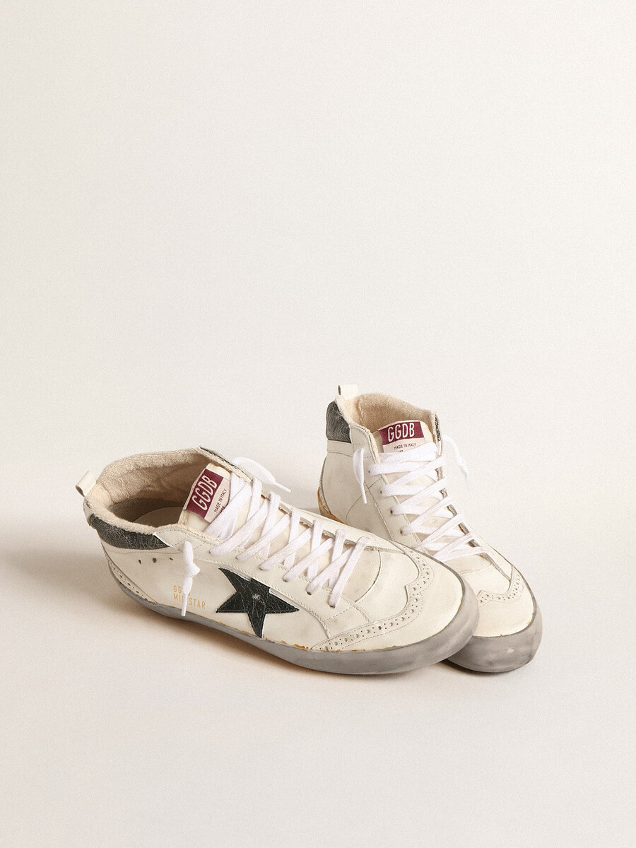 mid star met groene metallic leren ster en witte flits