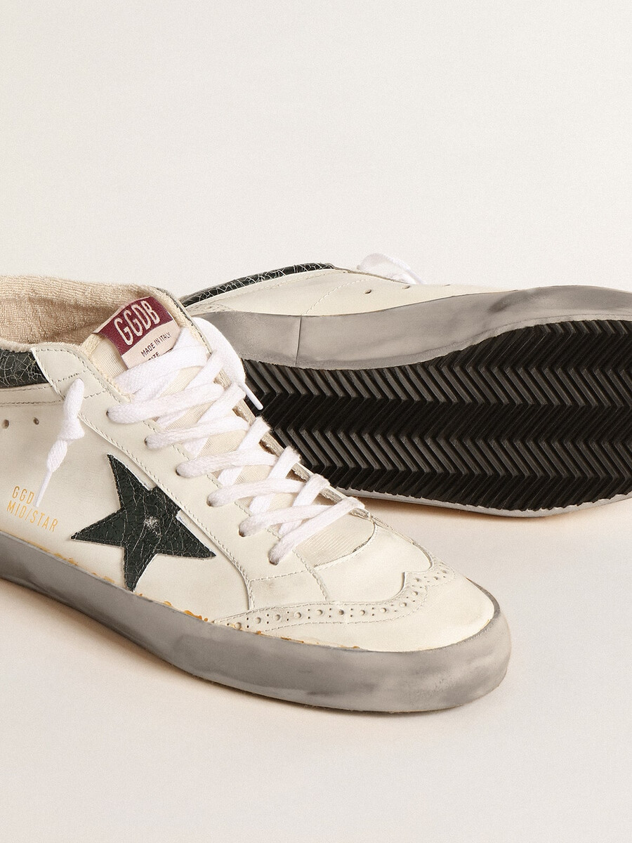 mid star met groene metallic leren ster en witte flits