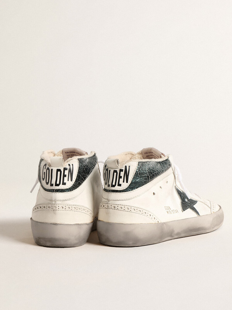 mid star met groene metallic leren ster en witte flits