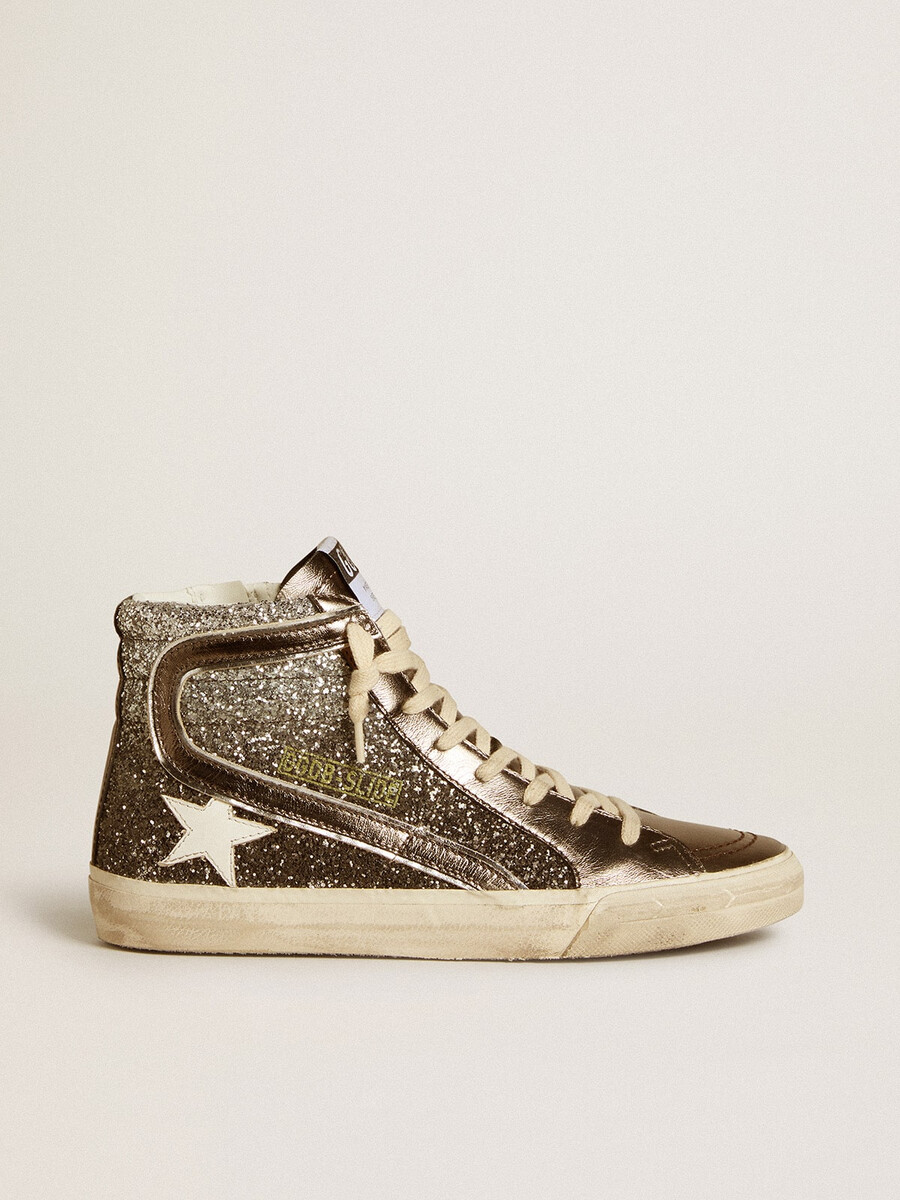 damesslippers in zwart en zilver met glitter leren ster en metallic accenten.