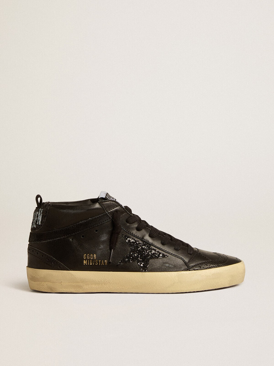 dames mid star in zwart nappaleer met zwarte glitterster en suède accenten.
