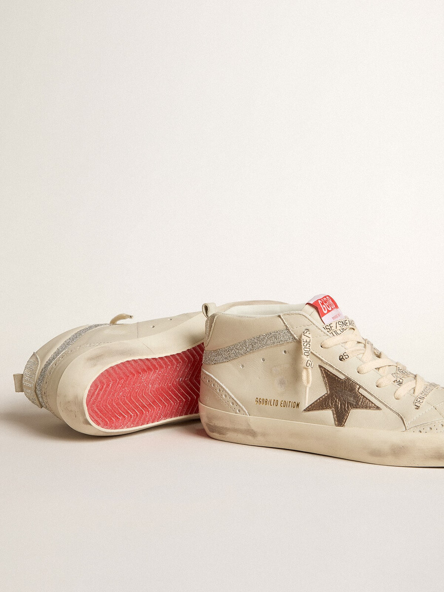 dames mid star ltd met bronzen leren ster en swarovski-kristallen.