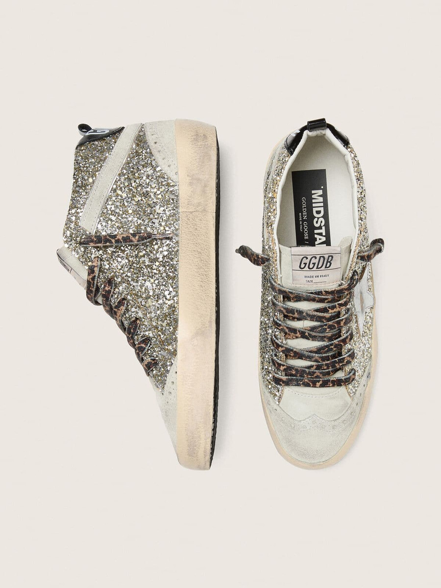 mid star in zilveren glitter met een ster van zilverkleurig metallic leer.