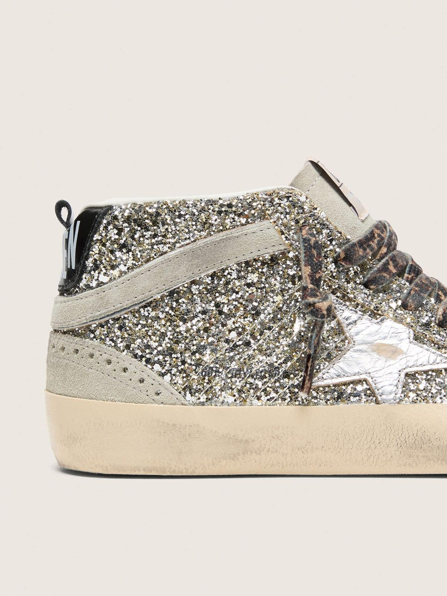 mid star in zilveren glitter met een ster van zilverkleurig metallic leer.
