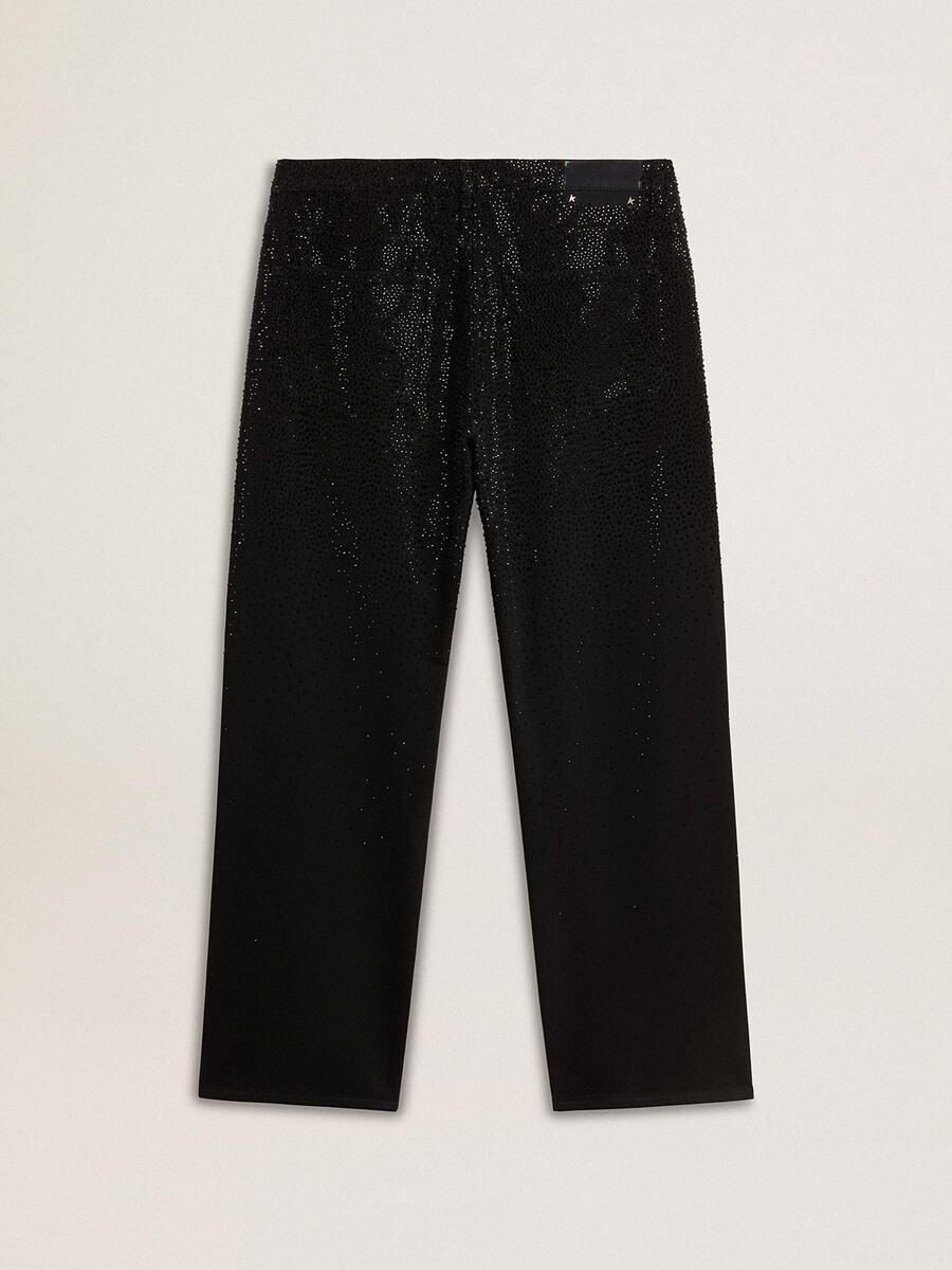 zwarte herenjeans met een losse pasvorm en een kristallen afwerking met kleurverloop.