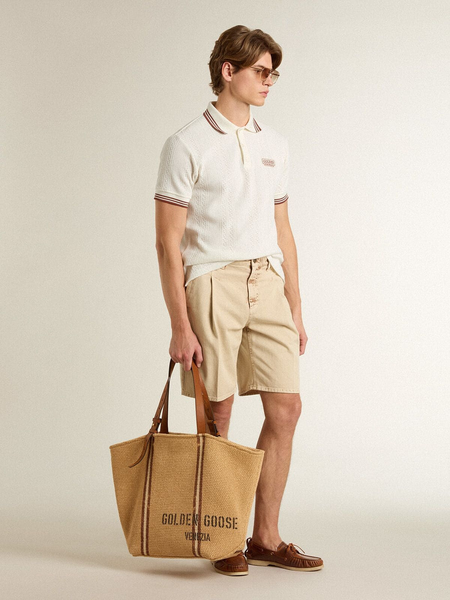 bermudashorts voor heren in beige denim met een gedragen look.