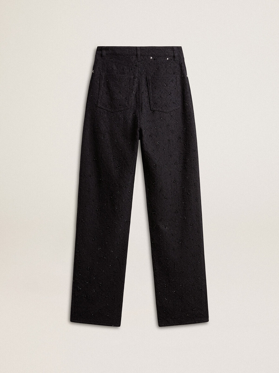 damesbroek van katoenen denim met versiering van kristallen en stenen.