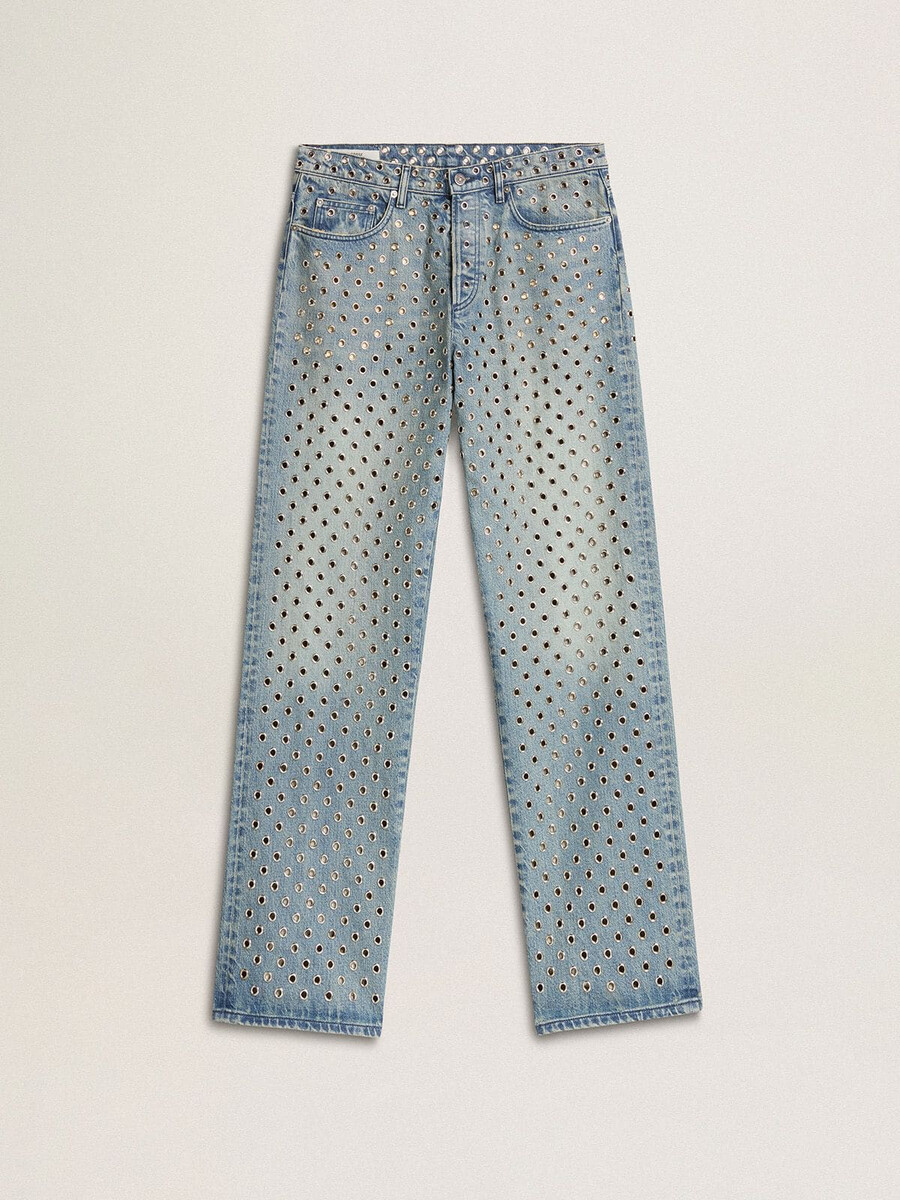 damesjeans met een verwassen look en overal perforaties.