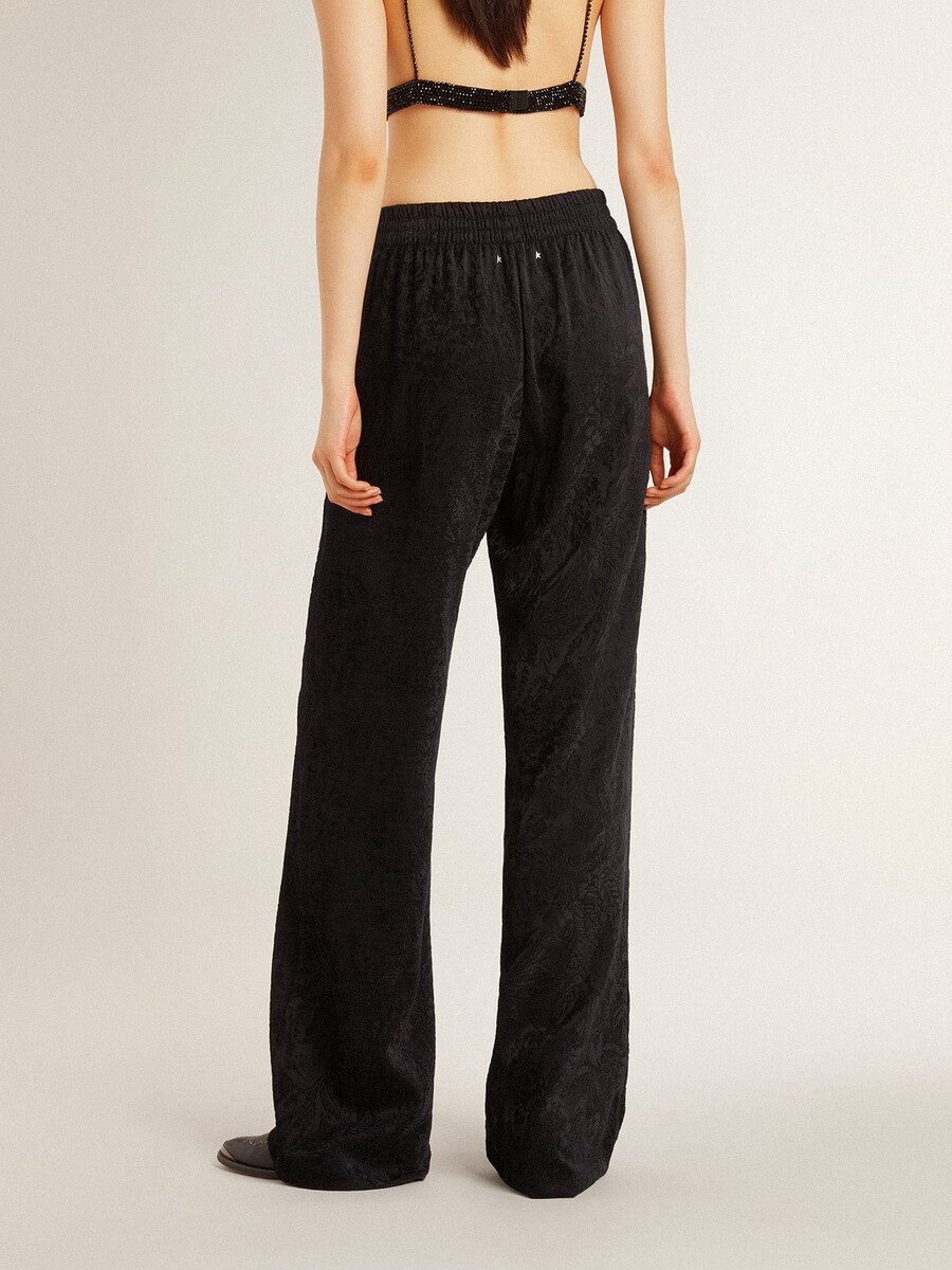 zwarte joggingbroek voor dames met een ton-sur-ton toile de jouy-print.