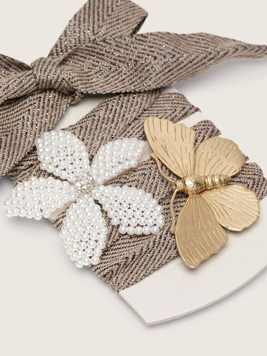 huidkleurige sparkling bruine zwarte en zilveren visgraatkant met twee applicatiebedeltjes.