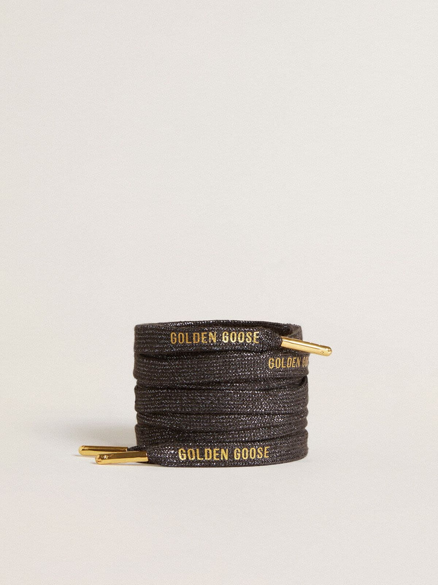 donkergrijze lurex veters met contrasterend goudkleurig logo