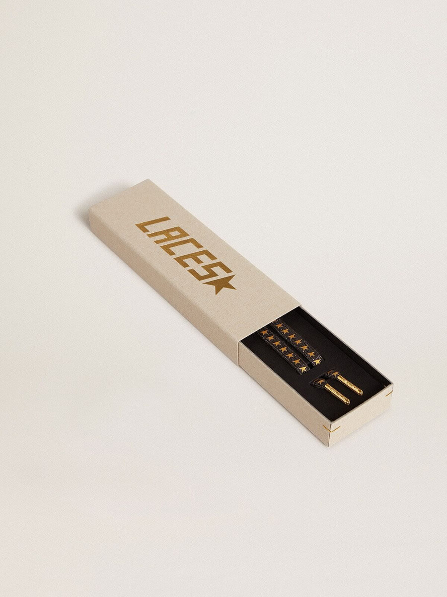 donkergrijze lurex-veters met contrasterende gouden sterren