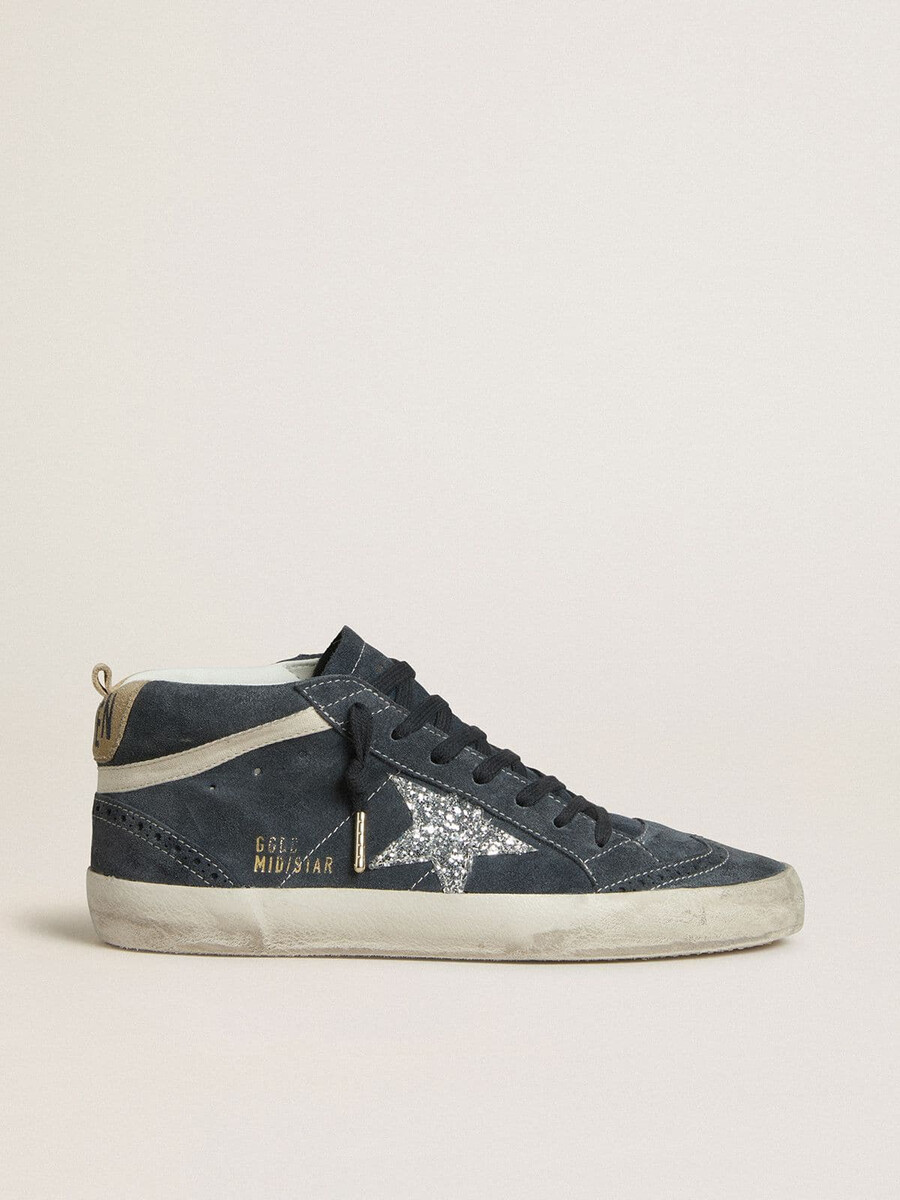 dames mid star in petrolblauw suède met zilveren glitterster en katoenen accenten.