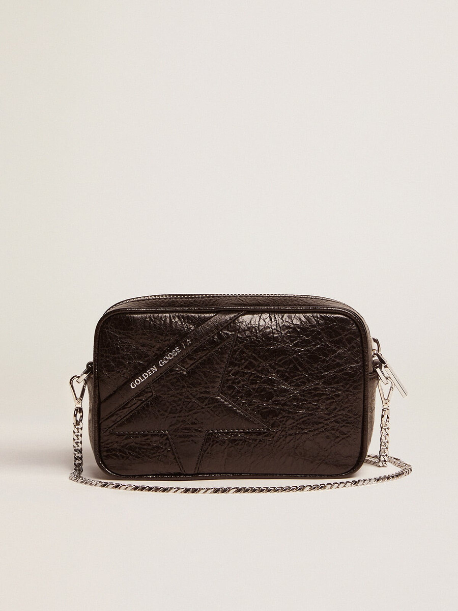 mini star-tas voor dames in glanzend zwart leer met een ton-sur-ton sterrenprint.