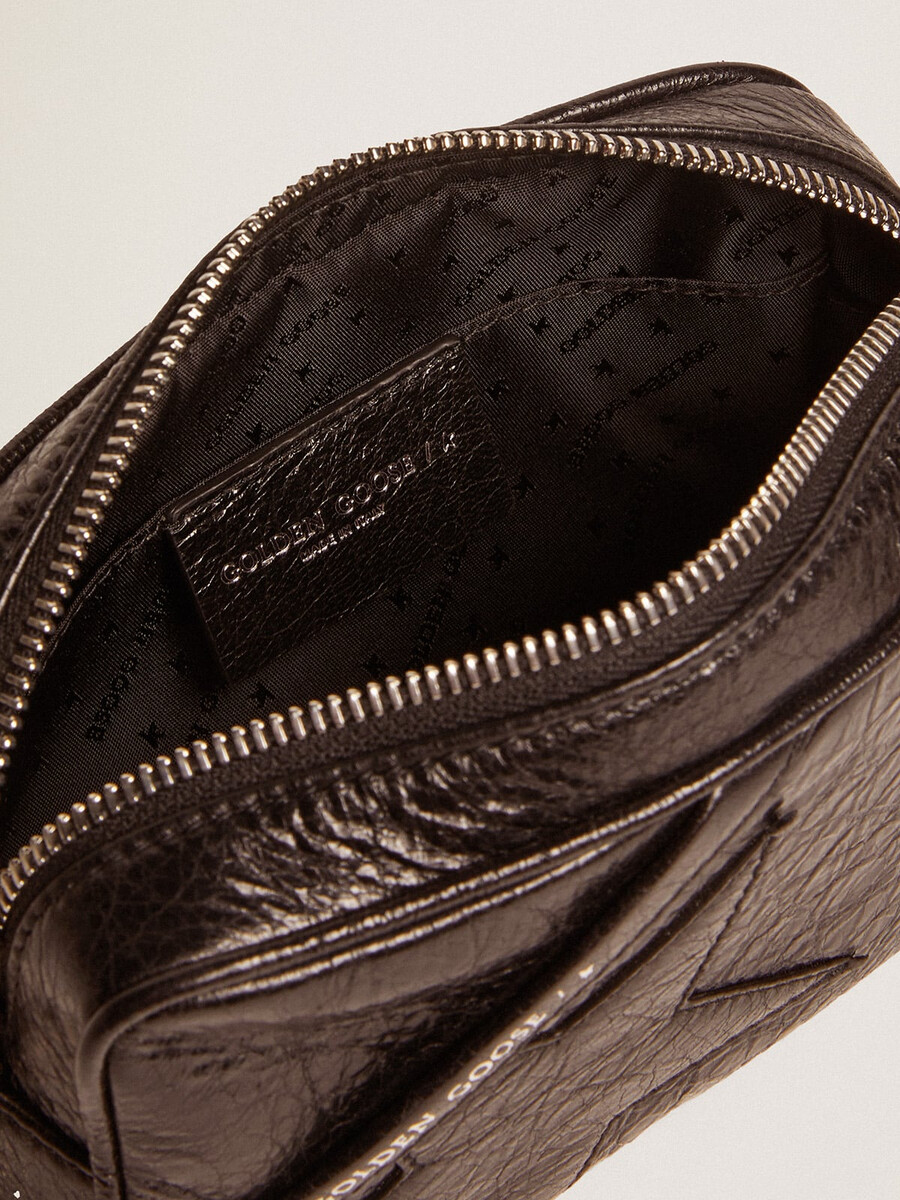 mini star-tas voor dames in glanzend zwart leer met een ton-sur-ton sterrenprint.