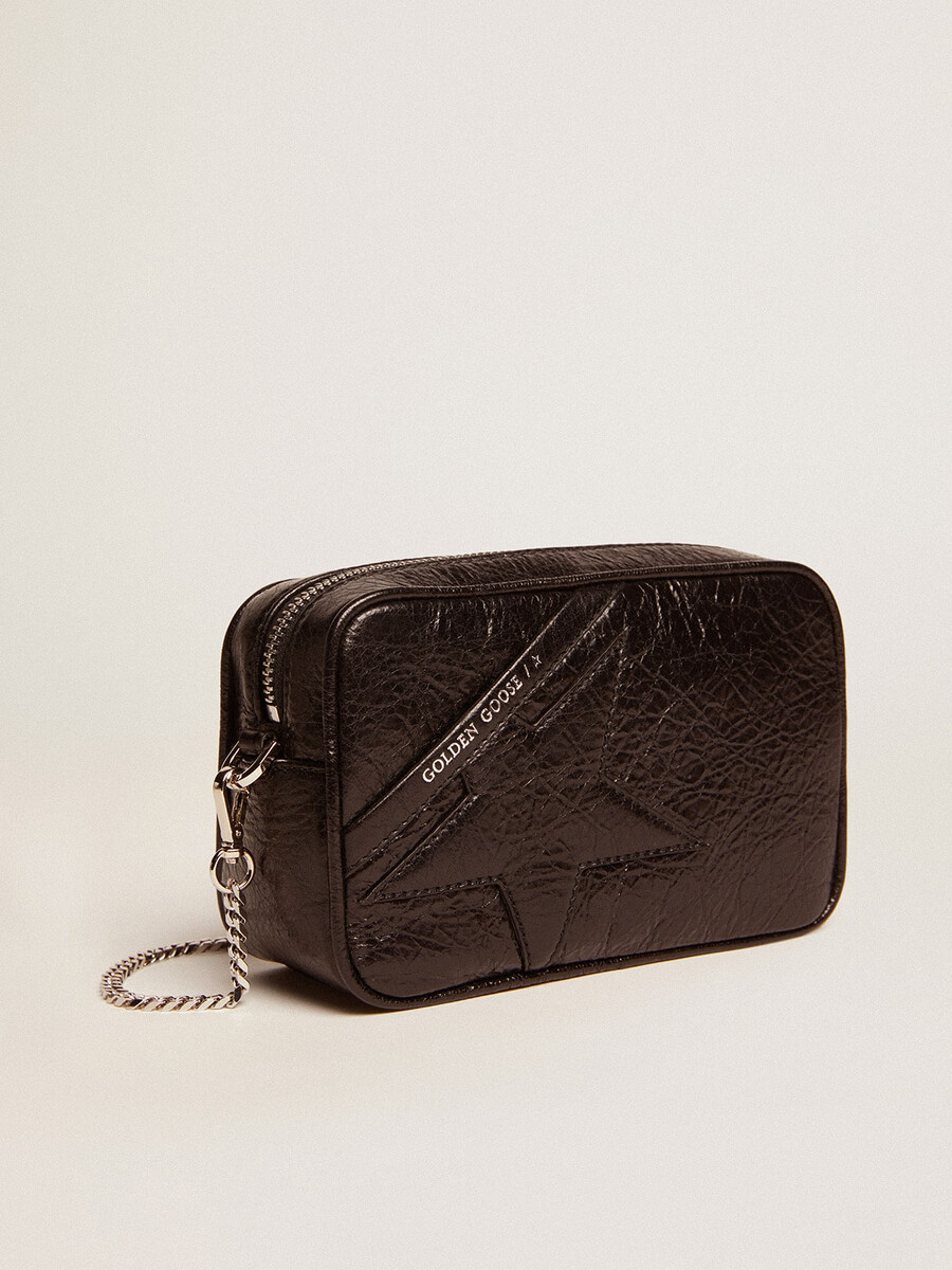 mini star-tas voor dames in glanzend zwart leer met een ton-sur-ton sterrenprint.