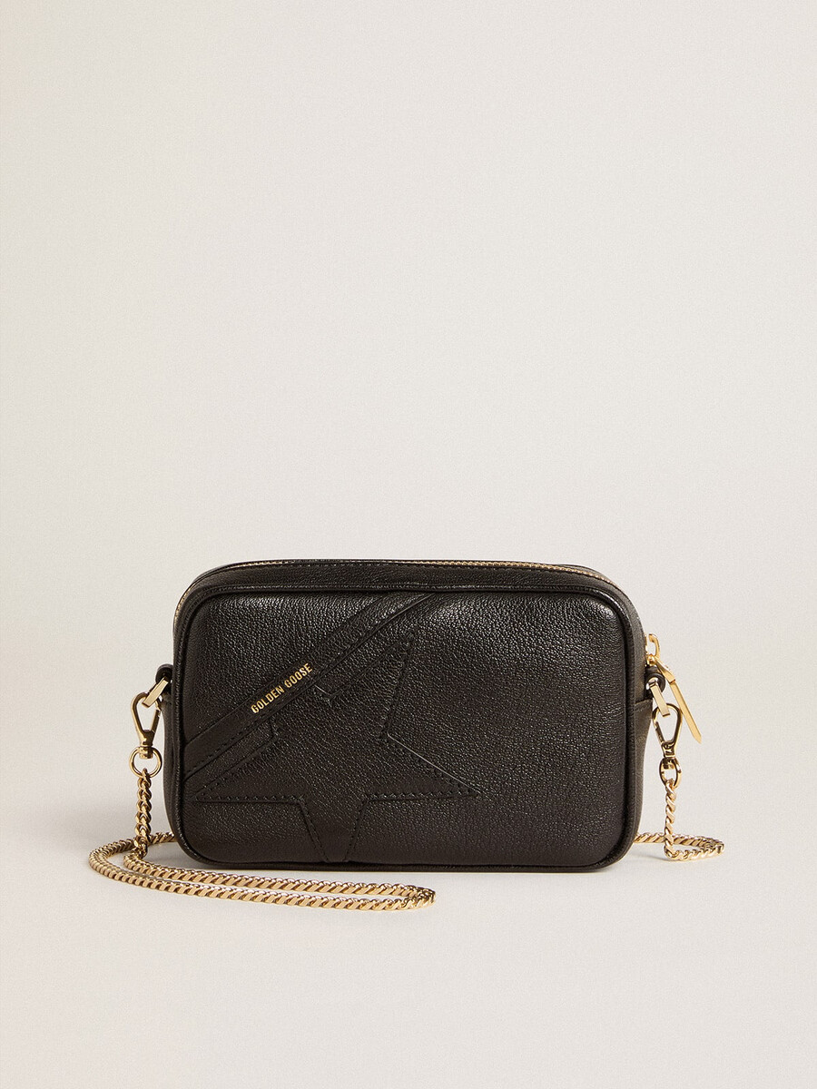 mini star bag van zwart leer met een ster in dezelfde kleur.