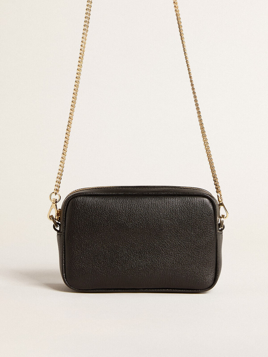 mini star bag van zwart leer met een ster in dezelfde kleur.