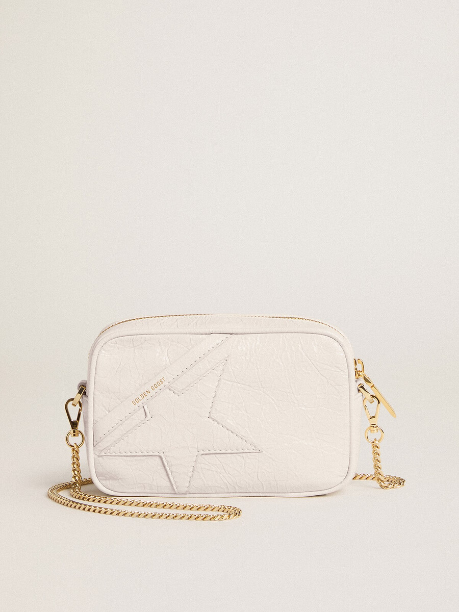 mini star bag van boterwit leer met een ton-sur-ton ster.