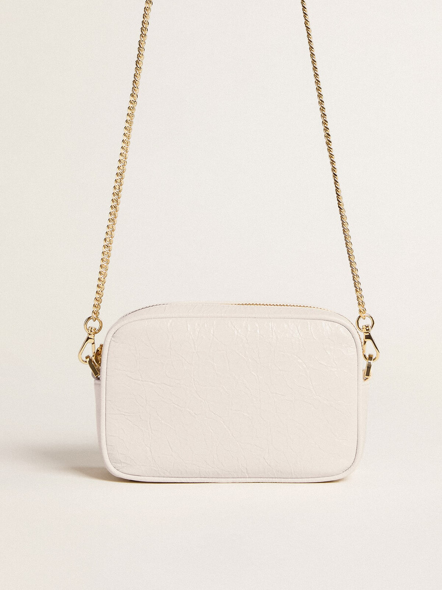 mini star bag van boterwit leer met een ton-sur-ton ster.