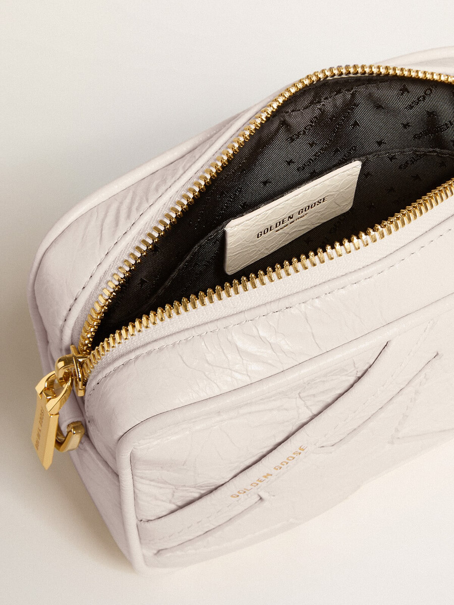 mini star bag van boterwit leer met een ton-sur-ton ster.