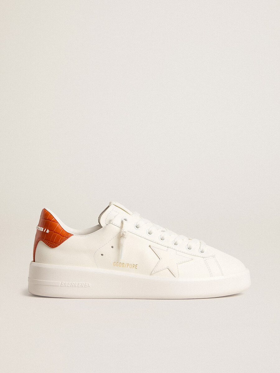 dames purestar met witte leren ster en oranje hielstuk.