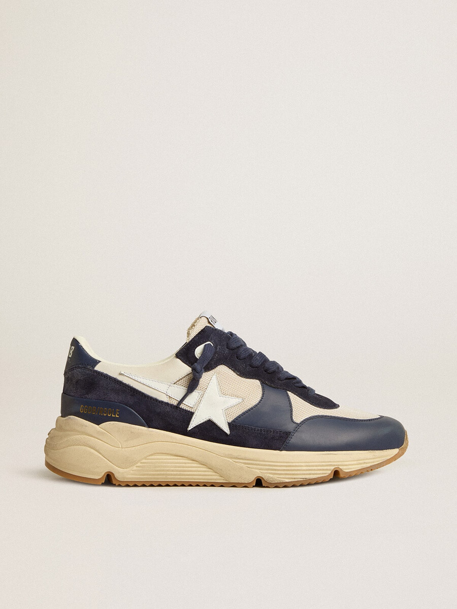 running sole van crèmekleurig mesh en blauw leer met een witte leren ster.